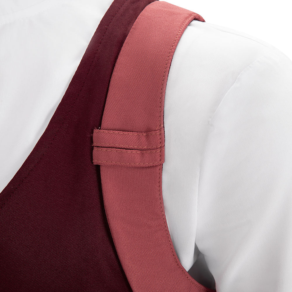 Close-up of the Falco pink shoulder strap showing the stitched keeper over the white shirt