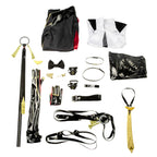 Evelyn Chevalier coat, top, trousers, gloves, harness straps, yellow tie and decorative accessories laid out separately