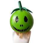 Front view of the Yumero Osuzuki green headpiece showing eye openings, a black grin and dark green stem and leaves