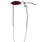 Alastor red oval cosplay eyewear with a hanging black beaded chain on a white background