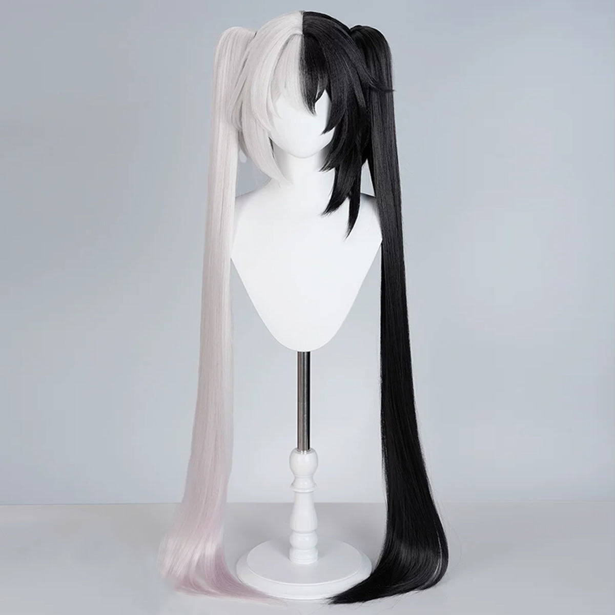 Front view of the Sparxie split black-and-white wig with long twin tails and layered bangs