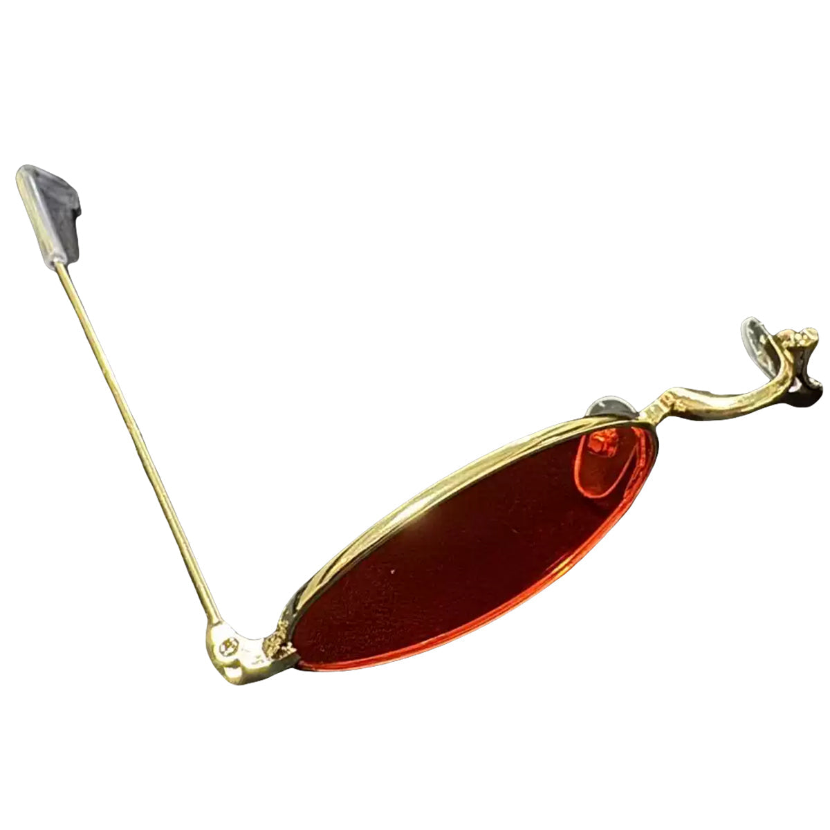 Angled view of the Alastor red oval eyewear prop showing the thin frame, nose pads and single arm