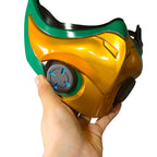 Angled front view of the Mizuki mask prop showing sculpted gold-colored panels and blue accents on the cheek disc