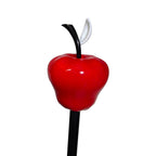 Close-up of the Lucifer cosplay cane topper showing the glossy red apple, curved black stem and white leaf