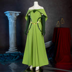 Three-quarter view of the Keyleth party dress showing the flowing green skirt and curved dark green accents