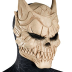 Three-quarter view of Kaiju No. 8 mask showing horn details, raised cheekbones and a weathered bone-colored finish