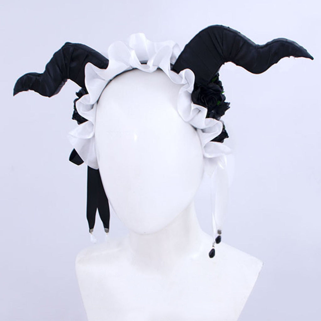 Front view of Fiona Gilman Crimson Priestess headpiece with curved black horns, white ruffles and dangling ribbons