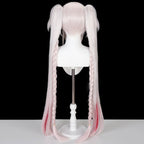 Back view of the Sparxie pink wig showing the short base, two long ponytails and braided strands