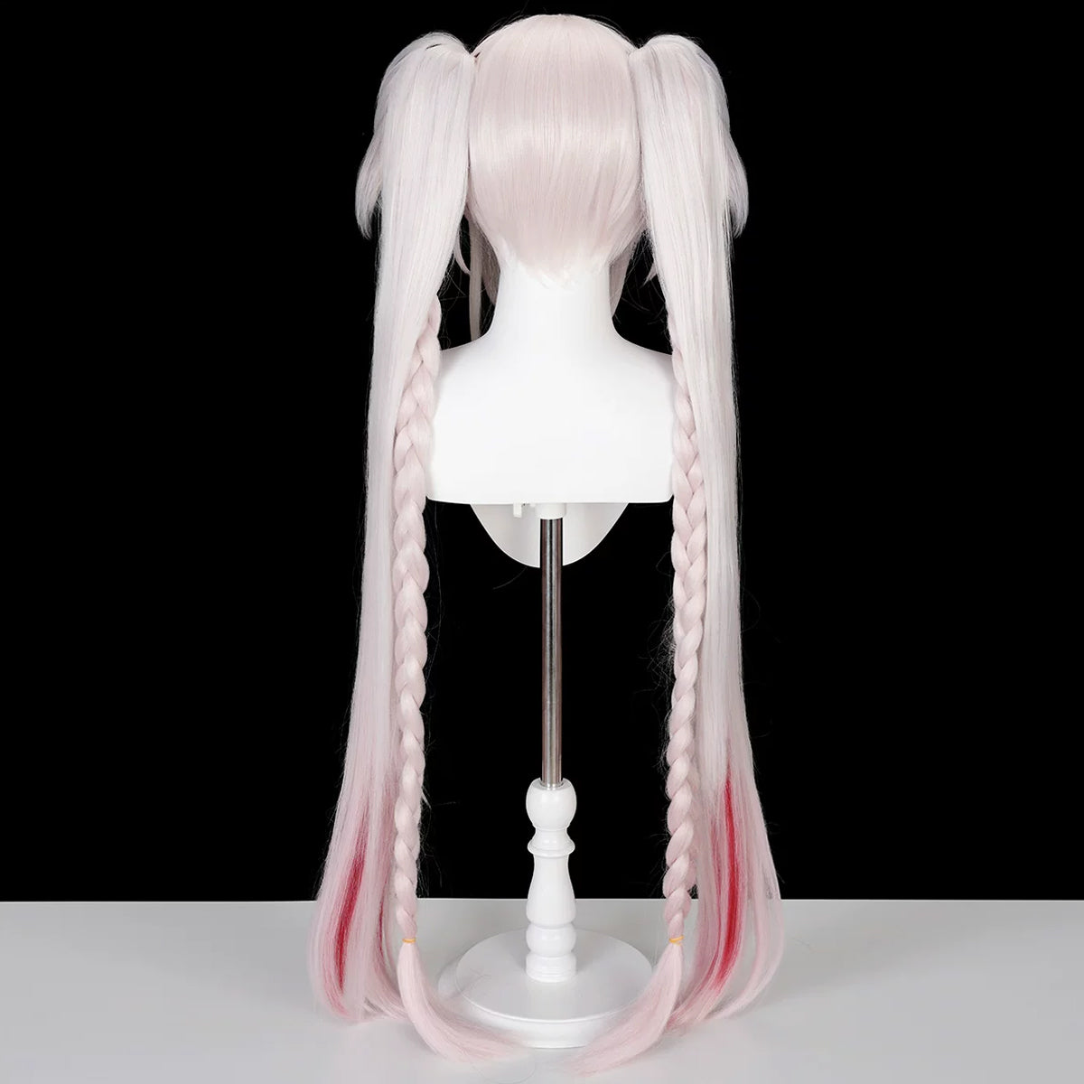 Back view of the Sparxie pink wig showing the short base, two long ponytails and braided strands