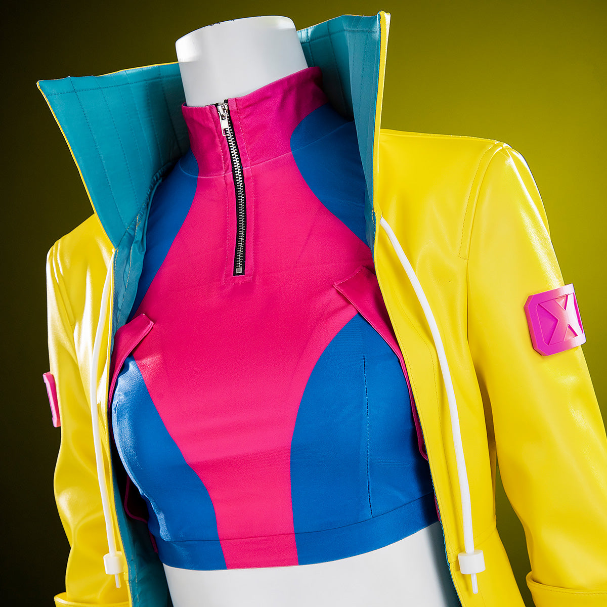 Jubilee costume chest detail showing the pink zip collar, blue top panels and teal-lined coat collar