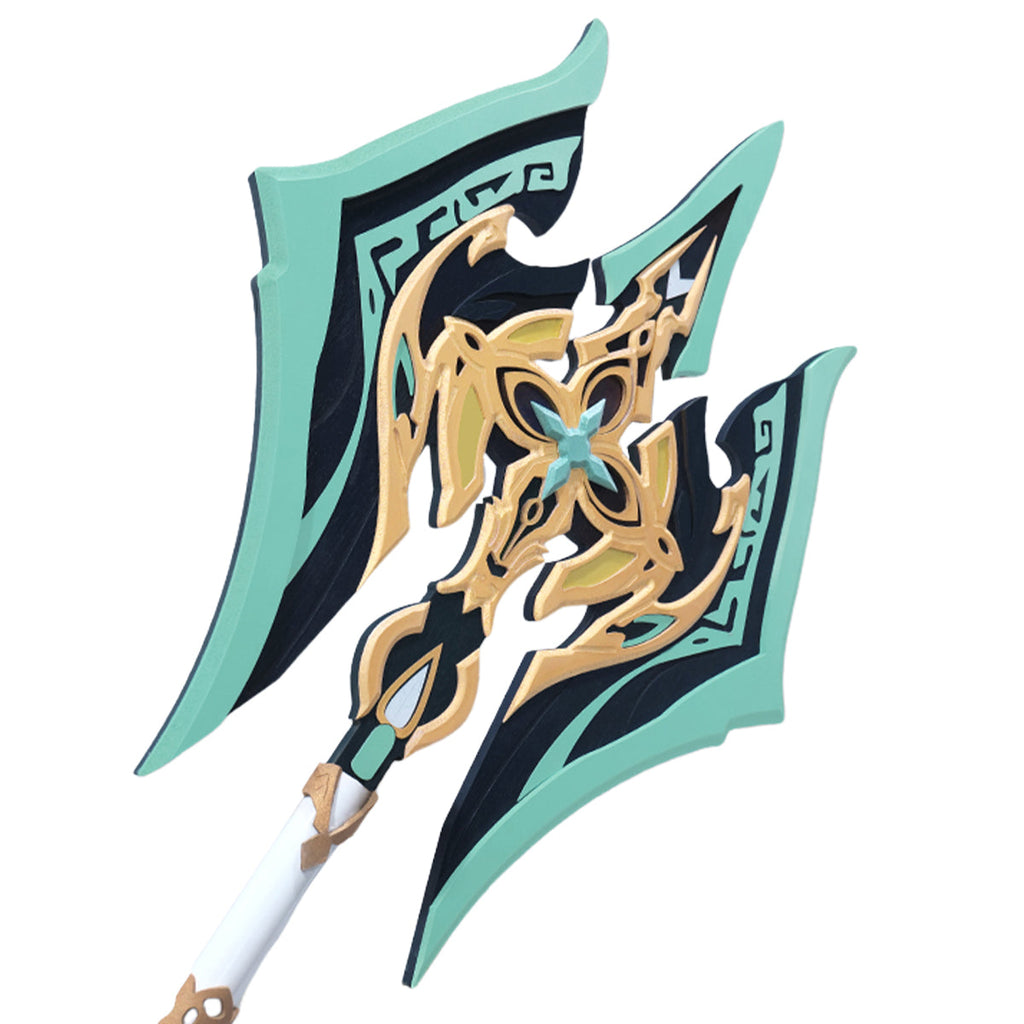Close-up of the Fei Xiao staff head showing green borders, dark panels and a gold-colored floral design