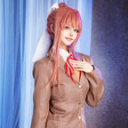 Front close-up of the Doki Doki Literature Club uniform showing brown lapels, gold-colored buttons, red ribbon and orange patterned vest