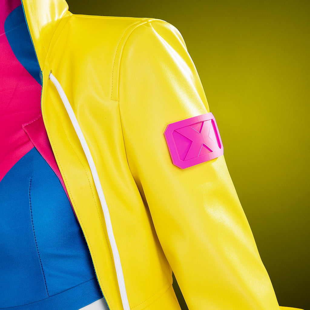 Close-up of the Jubilee yellow coat shoulder showing the pink X badge and white front trim