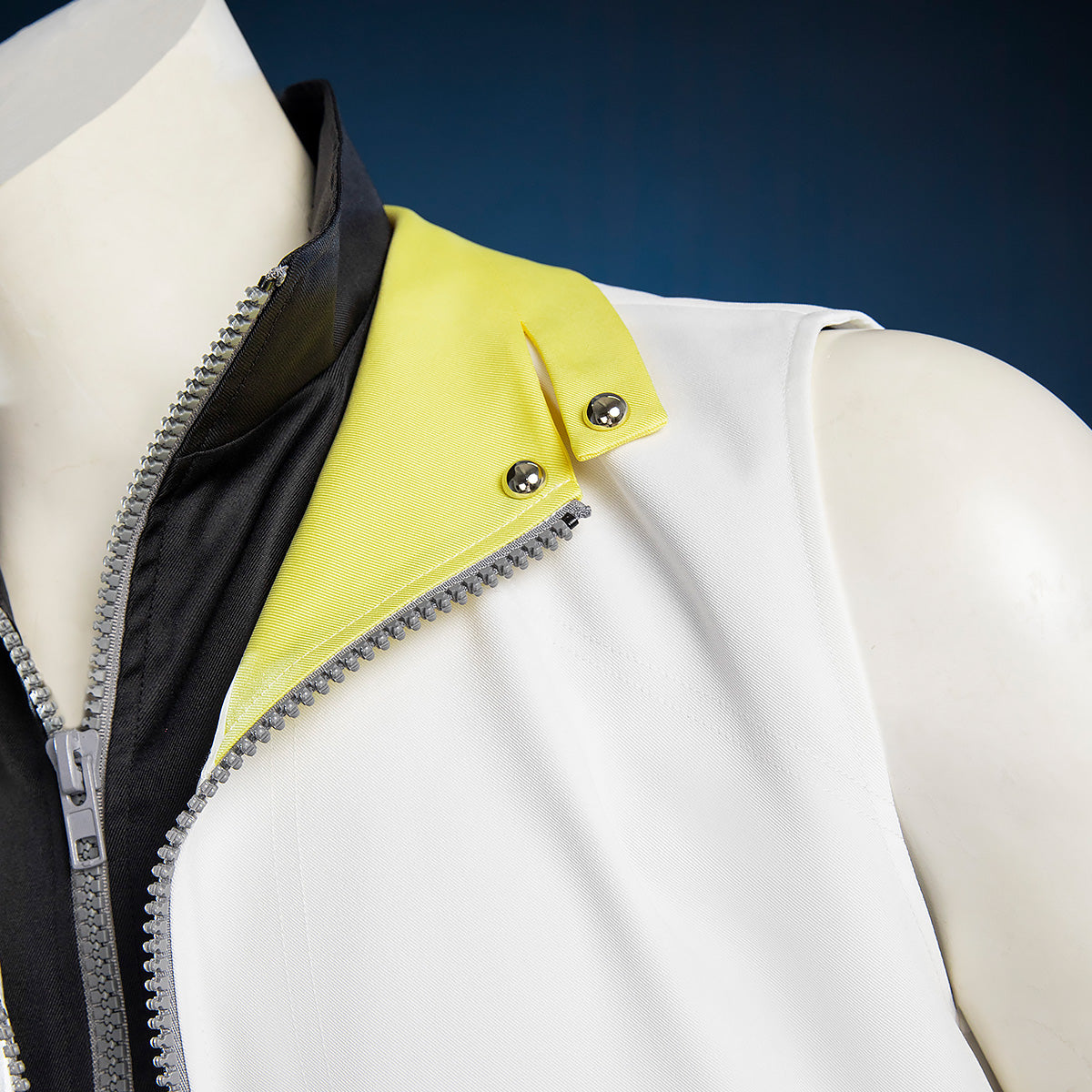 Riku costume collar detail showing yellow lapels with silver-colored snaps over a black zip-front collar