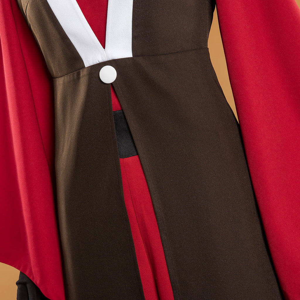 Mai costume waist detail showing the round white button and split dark front panels