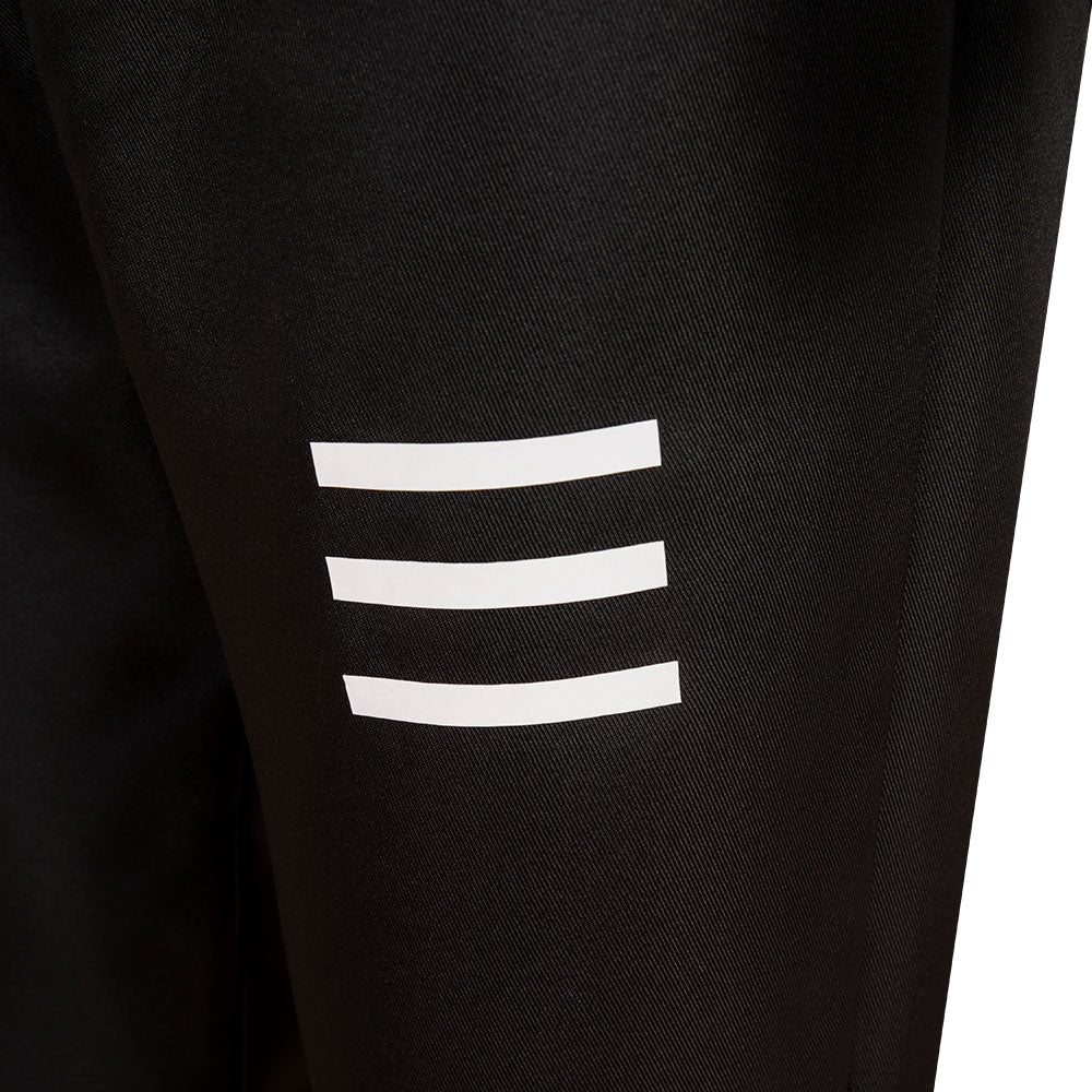 Falco black trouser detail showing three horizontal white stripes on the thigh