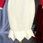 Grace Auvergne cream skirt detail showing vertical seams and a flared hem with pointed edges