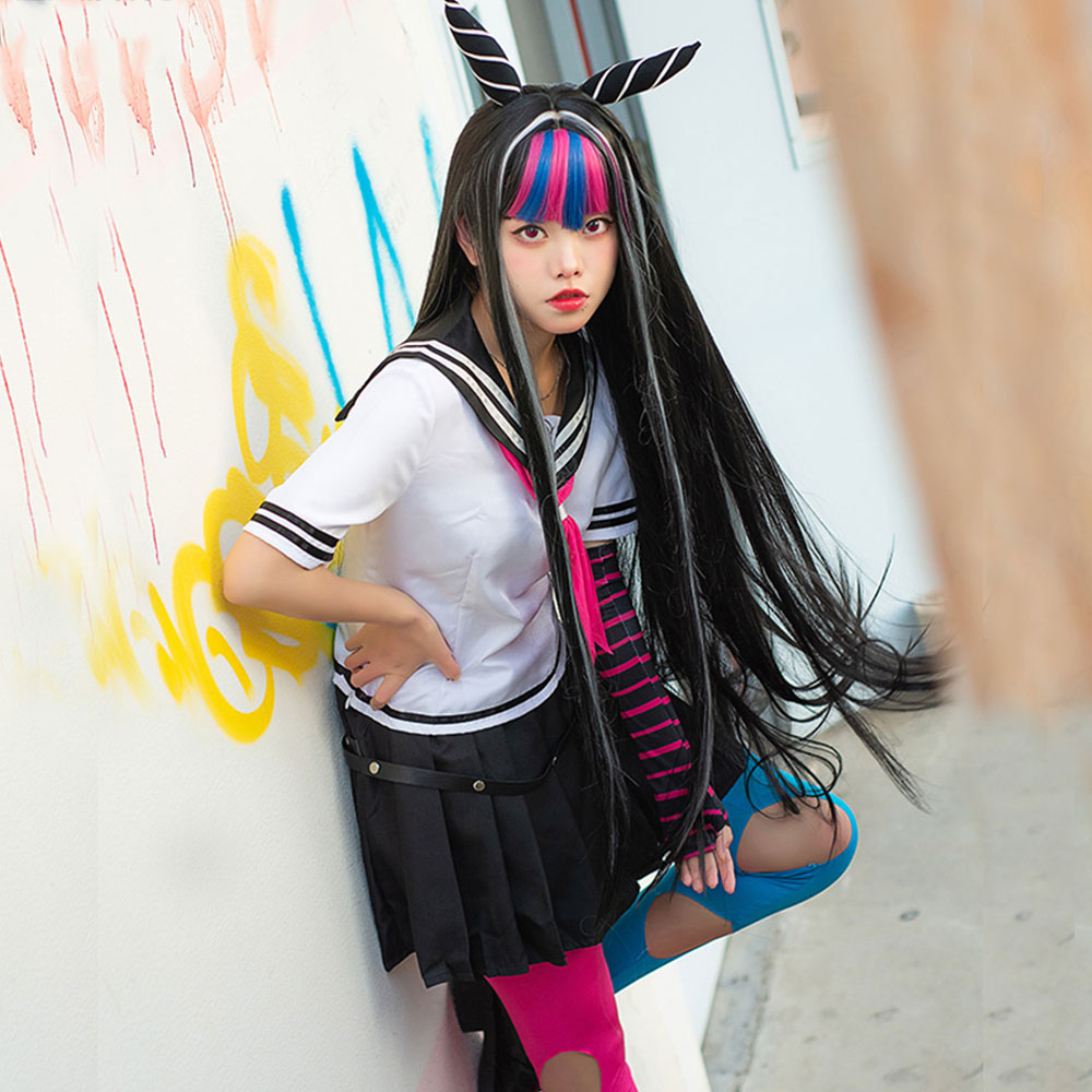Angled model view of the Ibuki Mioda costume showing the black pleated skirt and pink and blue cutout stockings